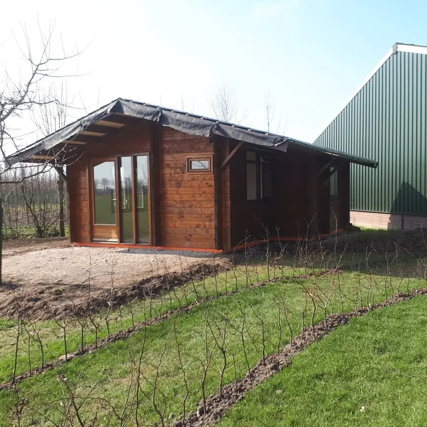 Houten chalet als tuinhuis